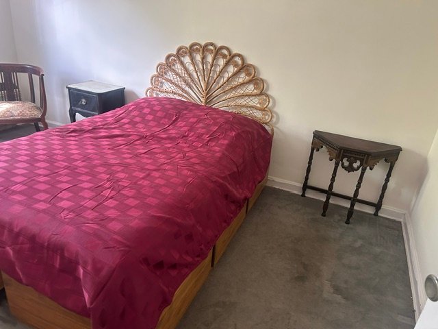 
            Finished bedroom after
            professional organizing